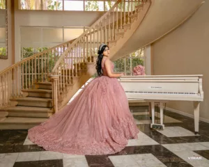 Quinceanera near staircase and piano
